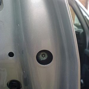 Remove plastic cover to reveal a T20 screw, screw this in to remove rear part of the door handle (screw it all the way in) you will see it moving on t