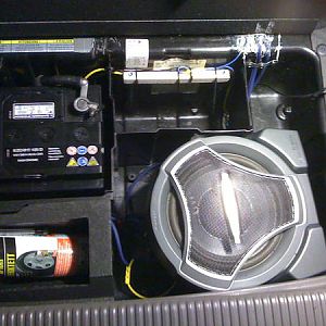 Pioneer Sub (with amp.) under cover in trunk. Ventilation in not needed , can´t hear any difference lid on and off. Sounds good.